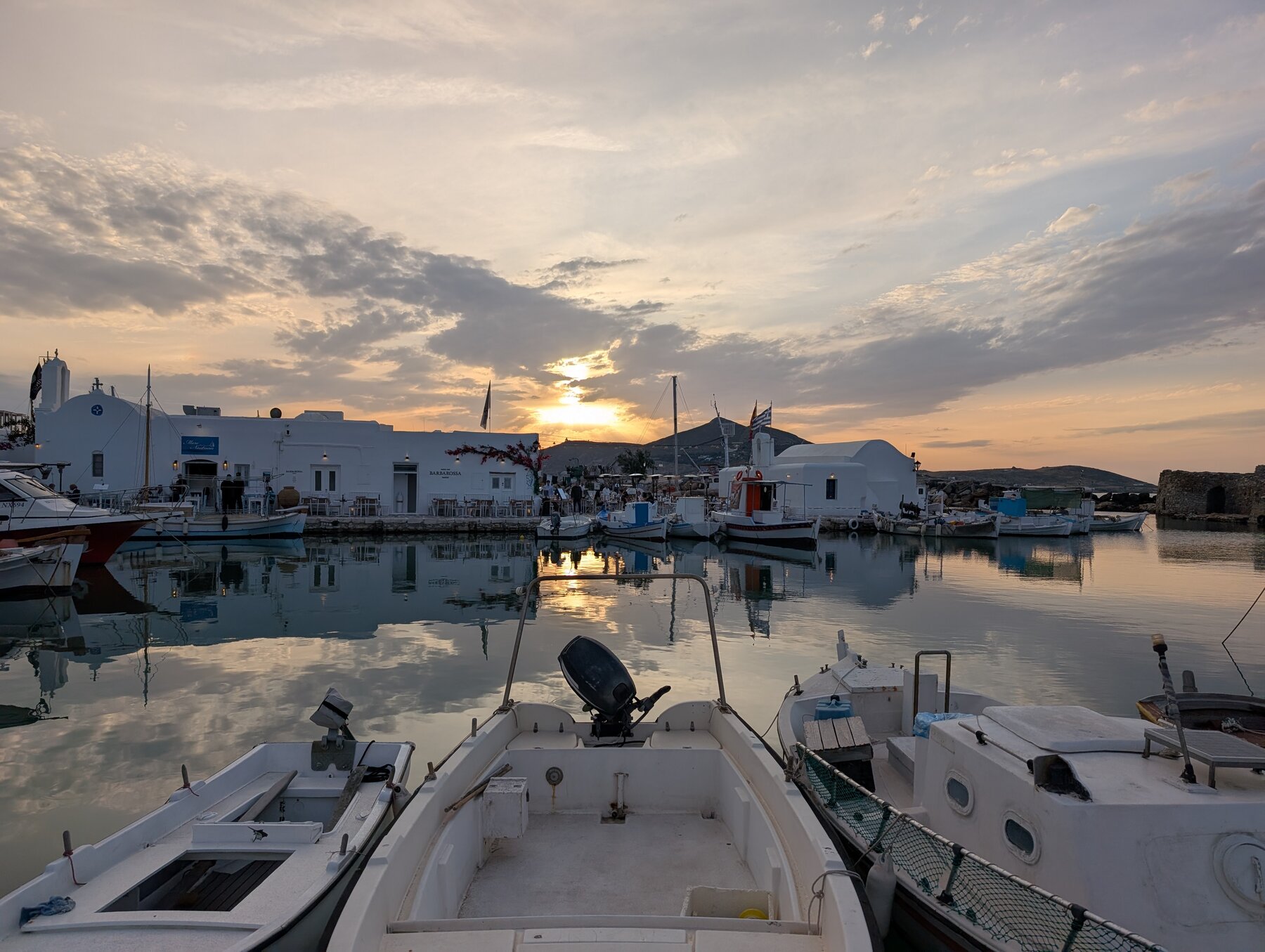 Sunset framed by the boats