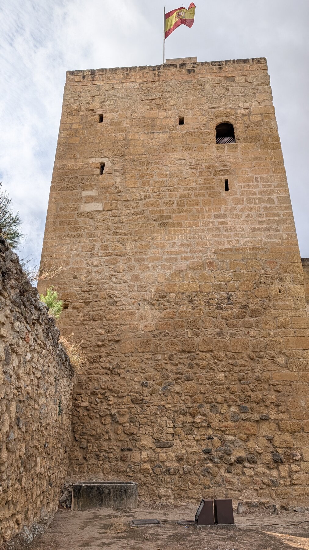 Atop the town of Antequera is a Moorish fortress, which fell to Castilian forces in 1410. Note the ancient Roman rock on the wall to the left and at the base of the tower, then the discontinuity to 14th-century Moorish construction for the top 2/3 of the tower.