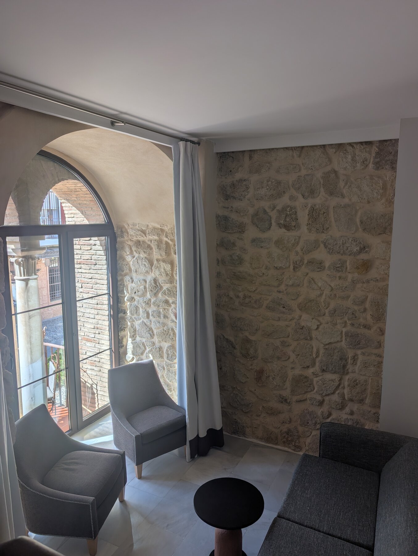 Our Cordoba hotel room, with the intact medieval wall, and our window peeking out from the wall.