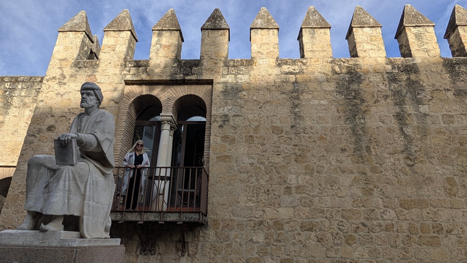 Tiffany from outside the wall looking back at our hotel room.  This statue is pretty well known (another cool part of our hotel room).  It depicts 12th-century Cordoban Ibn Rushd, also known as Averroes, who made significant contributions to various fields including philosophy, theology, medicine, and law.