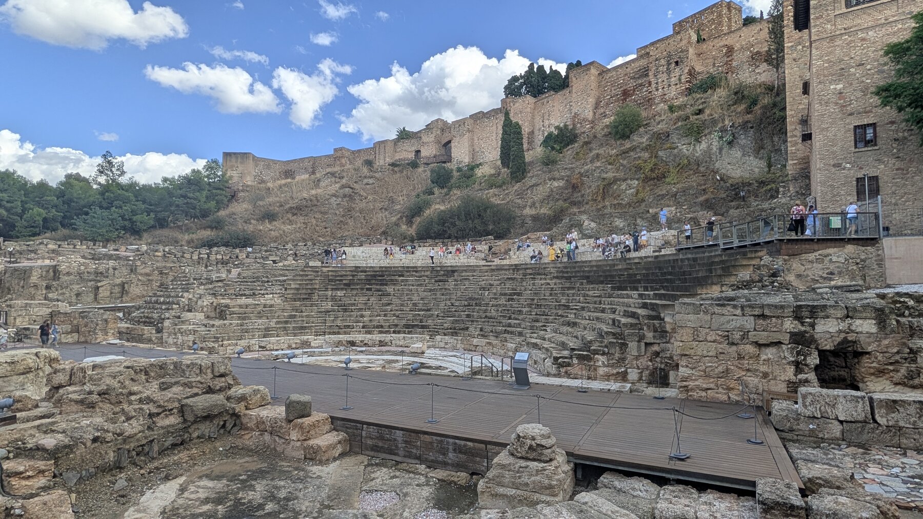 Roman Amphitheater, with the walls of the Alcazaba above