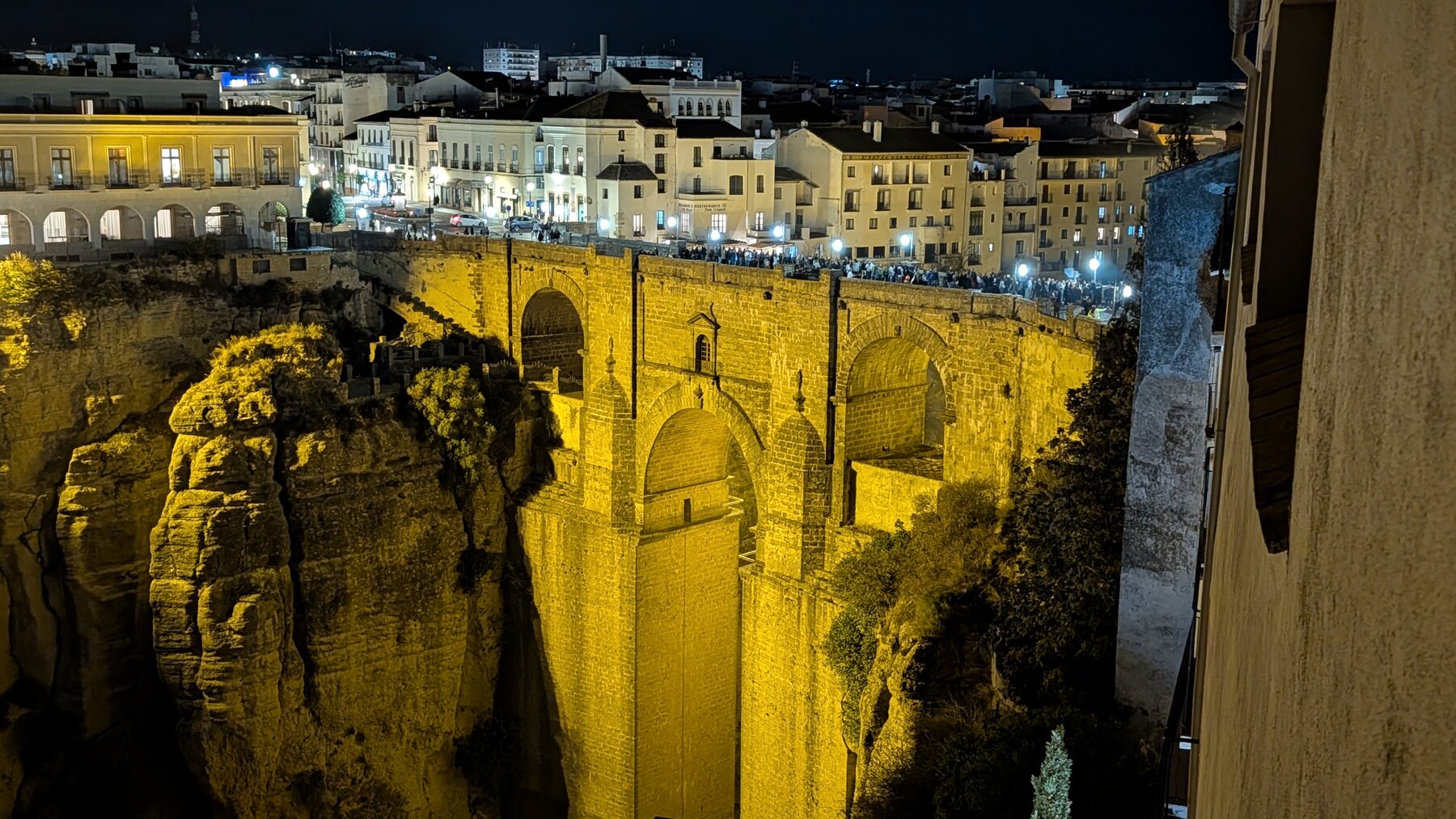 The Ronda bridge at night, from our hotel room. If you look closely, you can see hundreds of costumed kids lined up for a Halloween haunted mansion.
